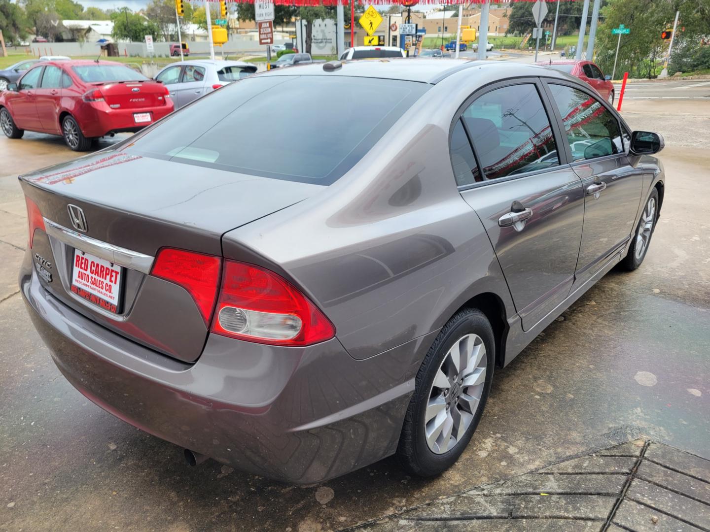 2009 GRAY Honda Civic EX Sedan 5-Speed AT (1HGFA16839L) with an 1.8L L4 SOHC 16V engine, 5-Speed Automatic transmission, located at 503 West Court, Seguin, TX, 78155, (830) 379-3373, 29.568621, -97.969803 - 2009 Honda Civic EX Sedan with a 1.8L L4 SOHC 16V, Automatic, Tilt, Cruise, AM/FM Touchscreen Stereo, Power Windows, Locks and Side Mirrors, Bluetooth, Navigation, Power Sunroof, Tinted Windows, Alloy Wheels, Rear Defroster and more!! - Photo#2